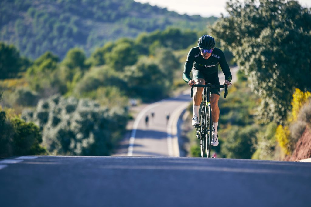 Cyclist climbing hill